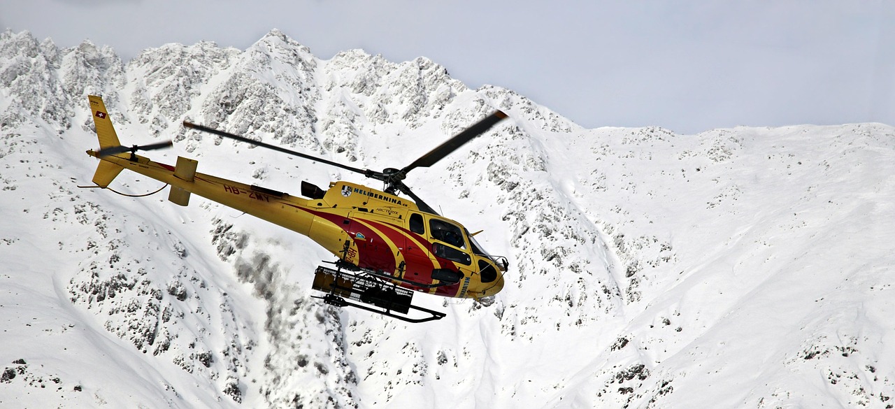 Helicopter soaring over the Swiss Alps
